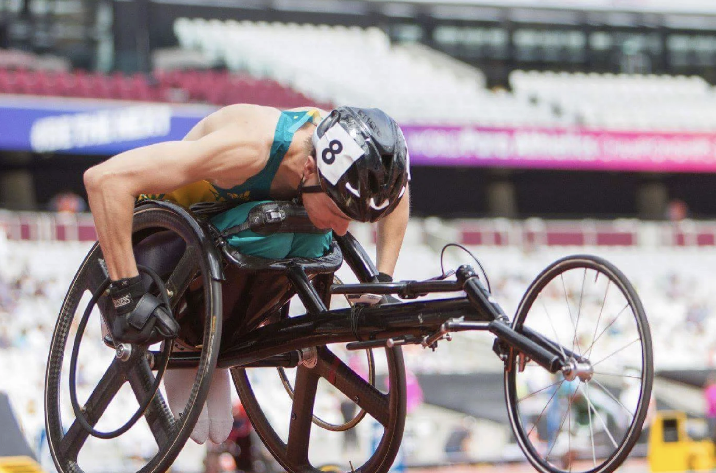 Sam McIntosh in racing chair on a track