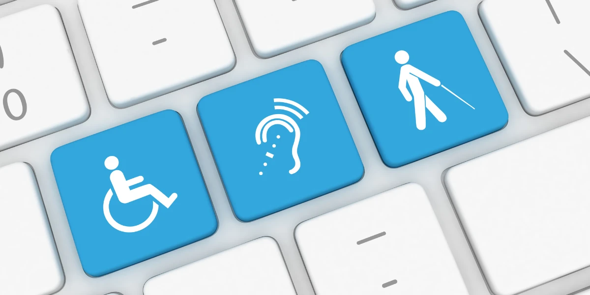 Three keyboard keys with blue backgrounds with symbols representing mobility disability, hard of hearing and visual impairment; representing digital accessibility.