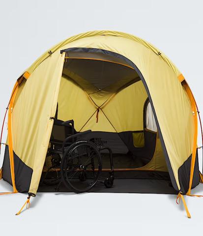 Wiwona 3 tent from the universal design collection, yellow body, black floor, and black wheelchair sitting in the vestibule. 